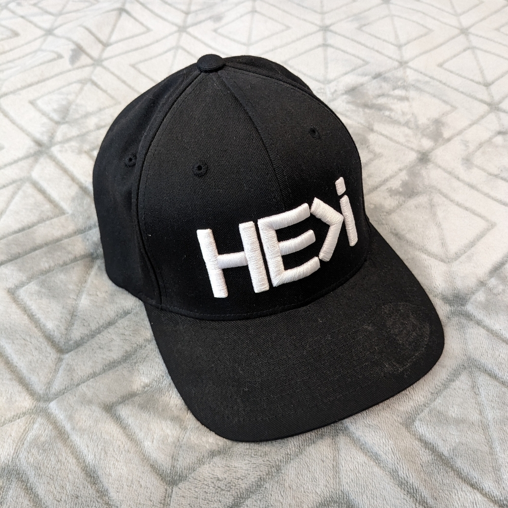 He>I he is greater than I trucker cap flexfit